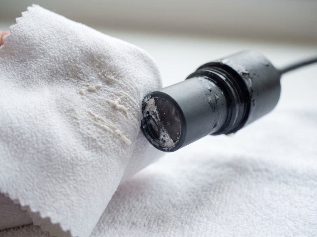 Cleaning salt creep mineral deposits from an ATO optical sensor tip